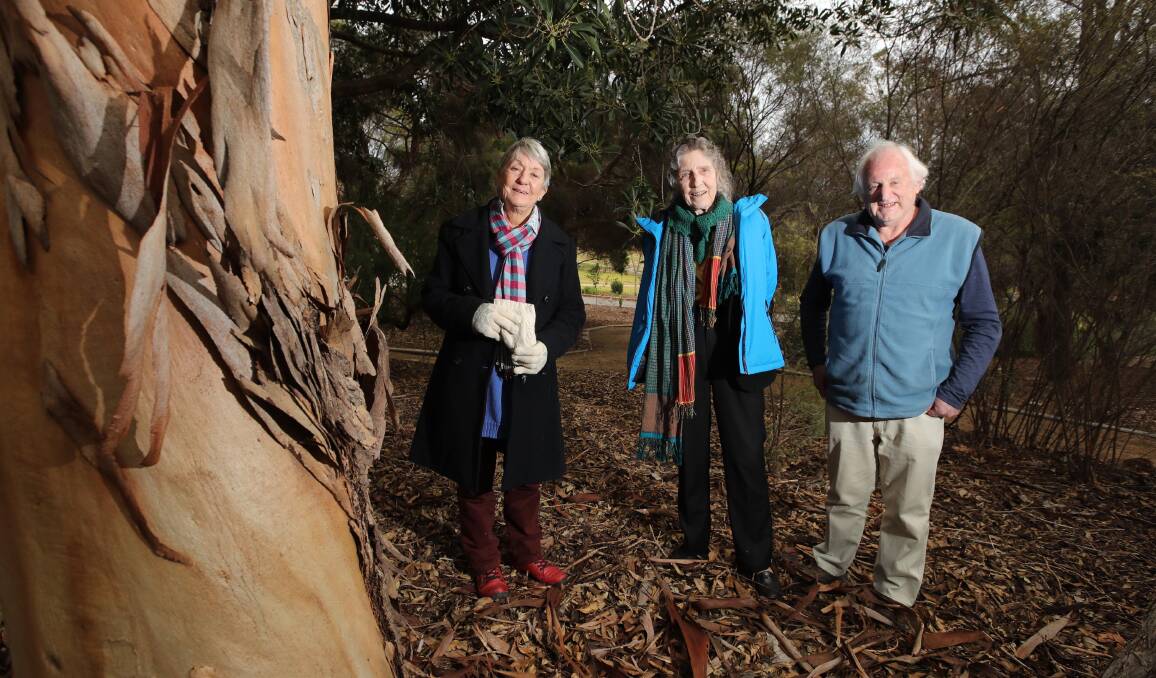 LAND MATTERS: Travelling permaculturalists Rowe Morrow and Lady Borton with Wagga's Greens member Michael Bayles at the Botanic Gardens. Picture: Les Smith