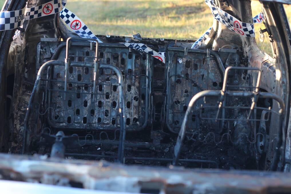 The interior shelling of the burnt out car in Lloyd. Picture: Emma Horn