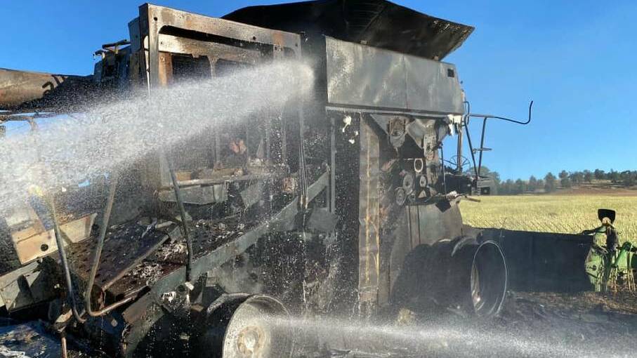 FIRE: A header was destroyed in a harvest fire near Forest Hill earlier in November. Another warning has been issued to harvesters ahead of high temperatures. Picture: Forest Hill RFS