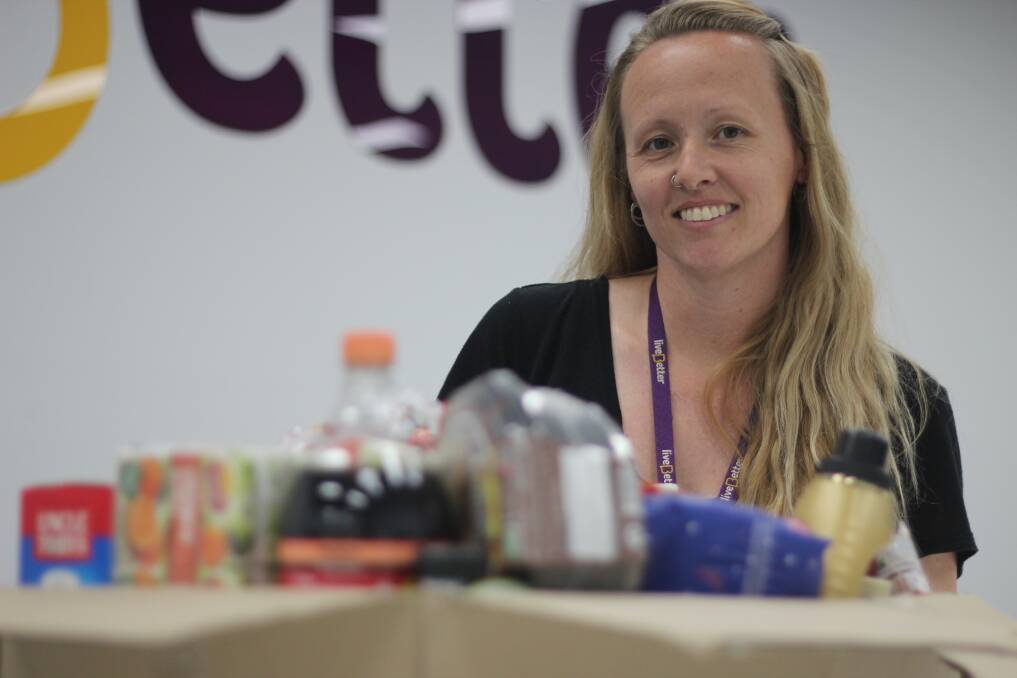 FOOD FOR THOUGHT: Live Better's Angela Rumble boxes up to 20 food hampers each week for the city's struggling, but she believes there are hundreds more than are not receiving the help they need. Picture: Emma Horn