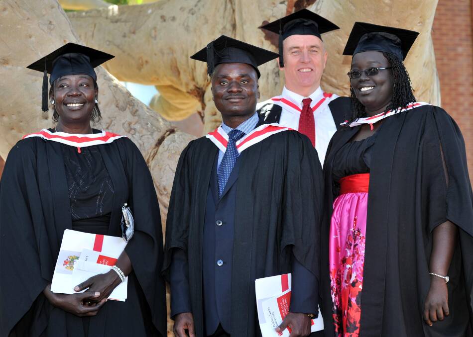 GRADUATING TOGETHER: In 2011, Susan Moi (Mrs Uchalla's mother) graduates with a Bachelor of Social Science Welfare, along with Matthew Rajabu in Bachelor of Social Work (Hons), Greg Lowe in Master of Human Service s Management, and Yangi Uchalla (nee Moi far right) with a Bachelor of Social Work (Hons).