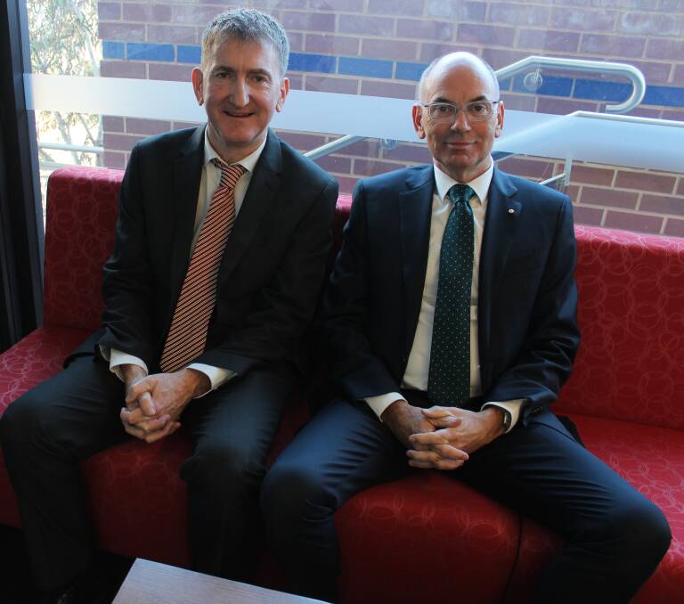 SPECIALTY CARE: Dr Martin Kennedy and Professor Gerard Carroll at the symposium in Wagga on Monday.