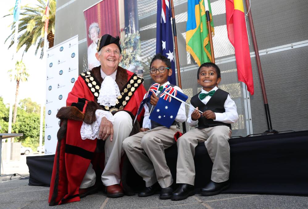 Mayor Greg Conkey with new citizens Marcus Daniel, 7, and Derrick Daniel, 4, at this year's Australia Day citizenship ceremony at the Victory Memorial Gardens. Picture: Les Smith