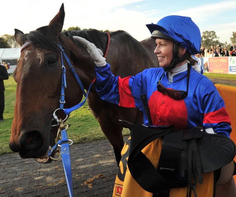 Kathy O'Hara and Voice Commander share a moment after winning the 2011 Wagga Gold Cup. Picture: Les Smith