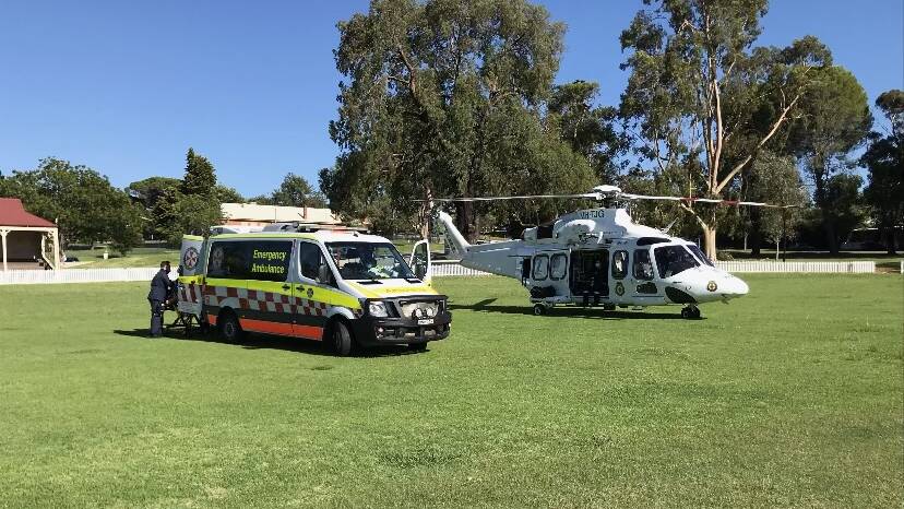 NSW Ambulance paramedics met a rescue helicopter in Narrandera after a crash near Sandigo on Friday. Picture: Supplied