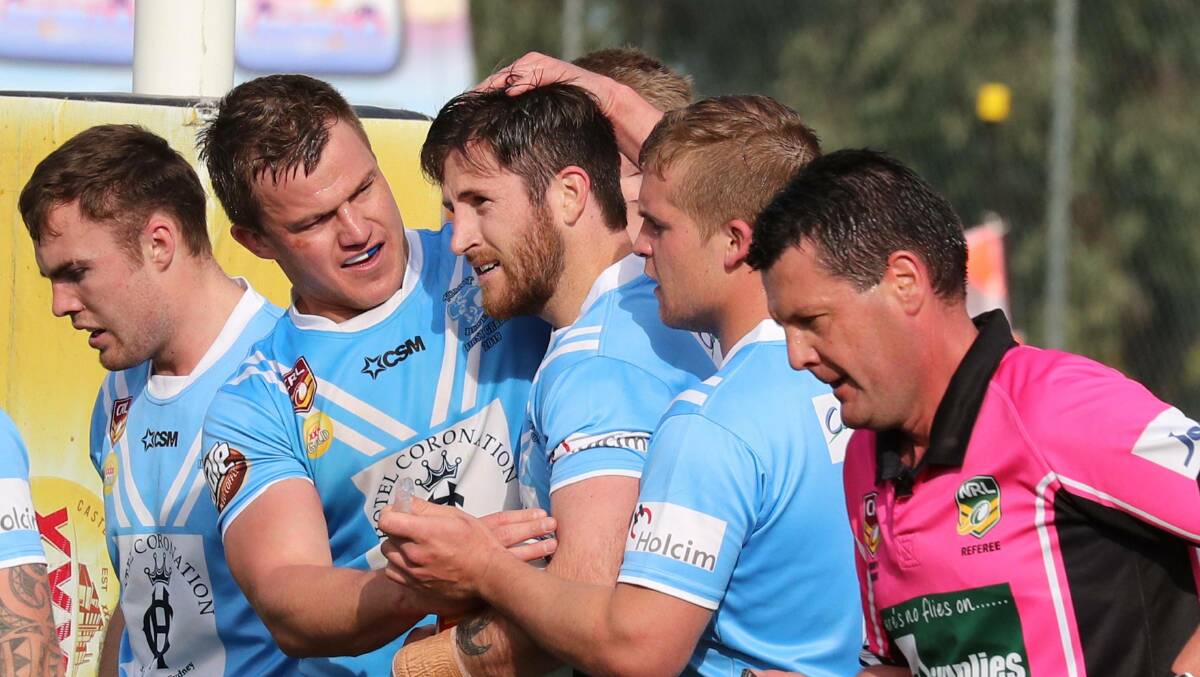 The Blues celebrate after Lachlan Bristow crossed the line for his second try of the day.