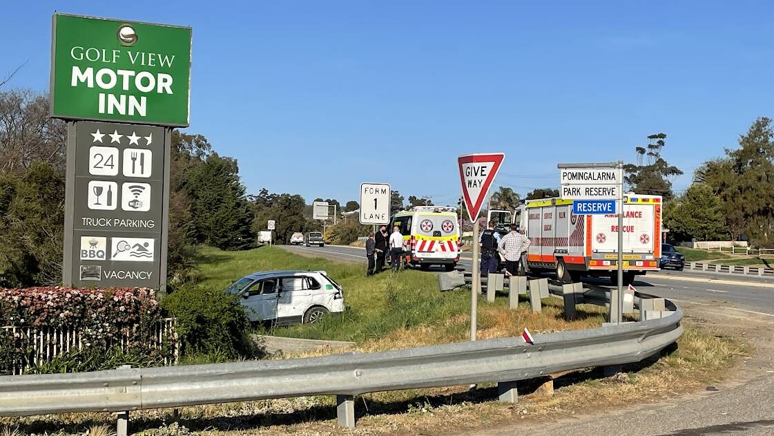 Emergency services at the scene of a crash near the McNickle Road and Sturt Highway intersection on the western edge of Wagga on Wednesday. Picture: Les Smith
