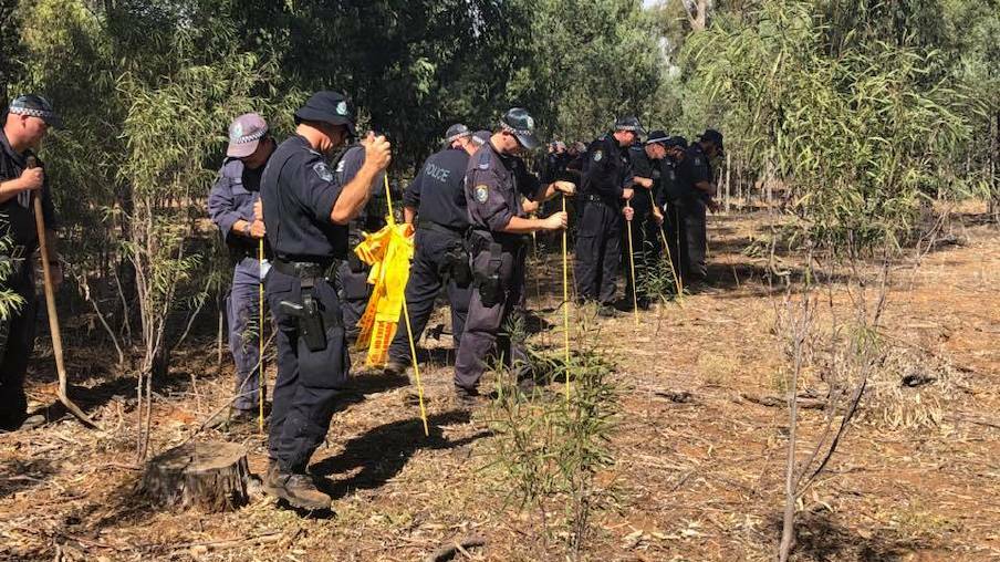 Police conduct a line search in Lester State Forest, looking for signs of Allecha Boyd in September 2017. 
