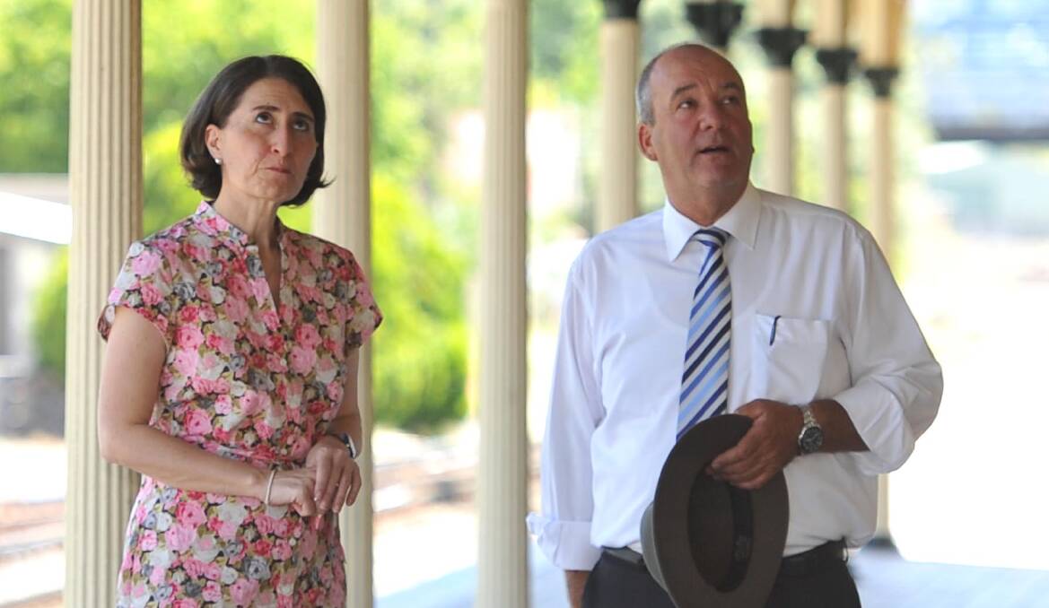 Then-transport minister Gladys Berejiklian and Wagga MP Daryl Maguire at Wagga train station in 2015. File image