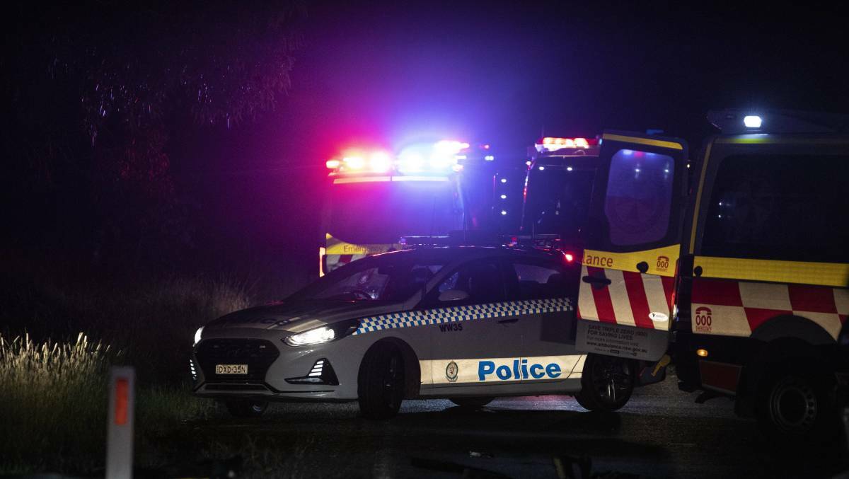 Emergency service crews at the scene of a fatal crash on Holbrook Road at the Gelston Park Road intersection south of Wagga in March. Picture by Ash Smith