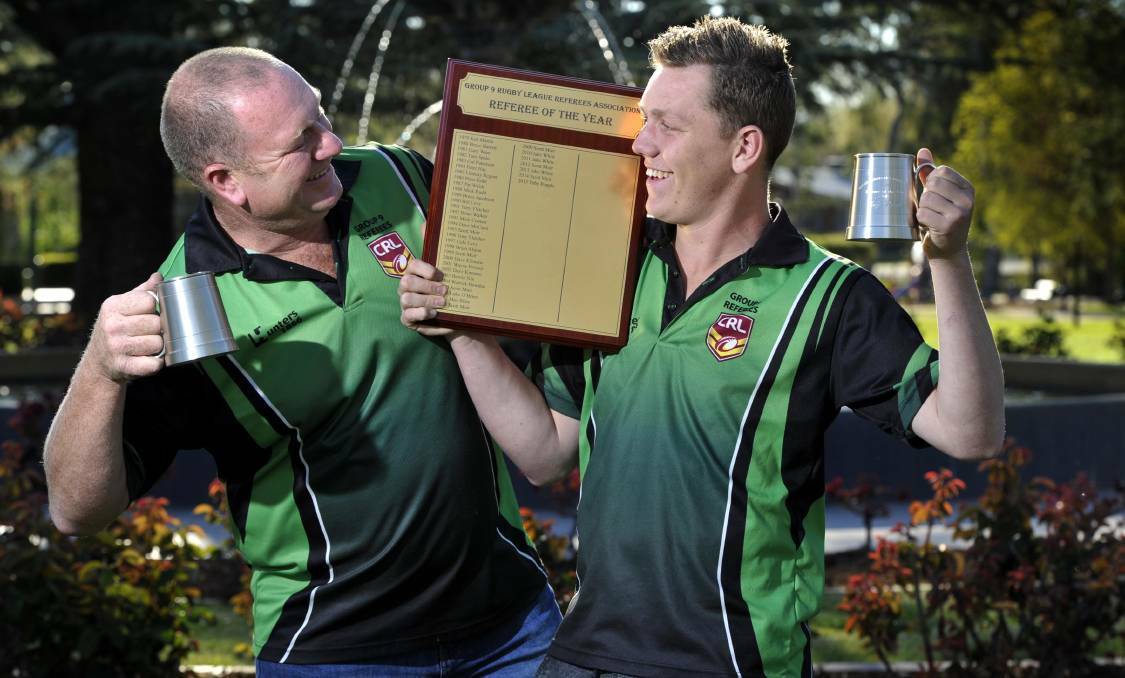 Kale Popple and his son Toby toast their awards following the Group Nine referees association night in 2015. Picture: Les Smith