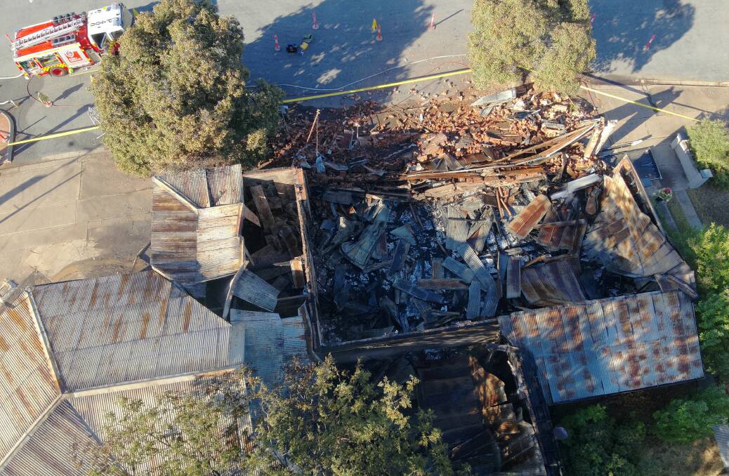 Fire and Rescue NSW crews responded to a blaze at an old petrol station and mechanic workshop in Narrandera on Sunday night. Police are investigating the cause. Picture by Fire and Rescue NSW