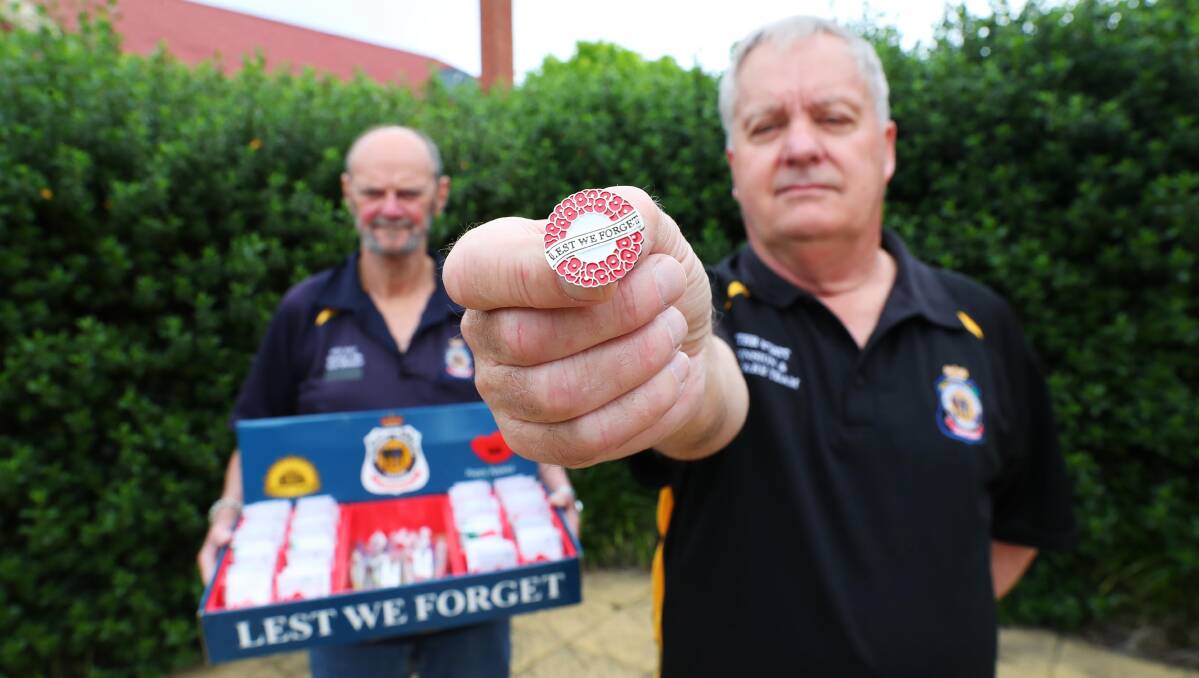 LEST WE FORGET: Wagga RSL sub-branch members Ken May and Peter Wyatt have poppies at the ready ahead of Remembrance Day. Picture: Emma Hillier
