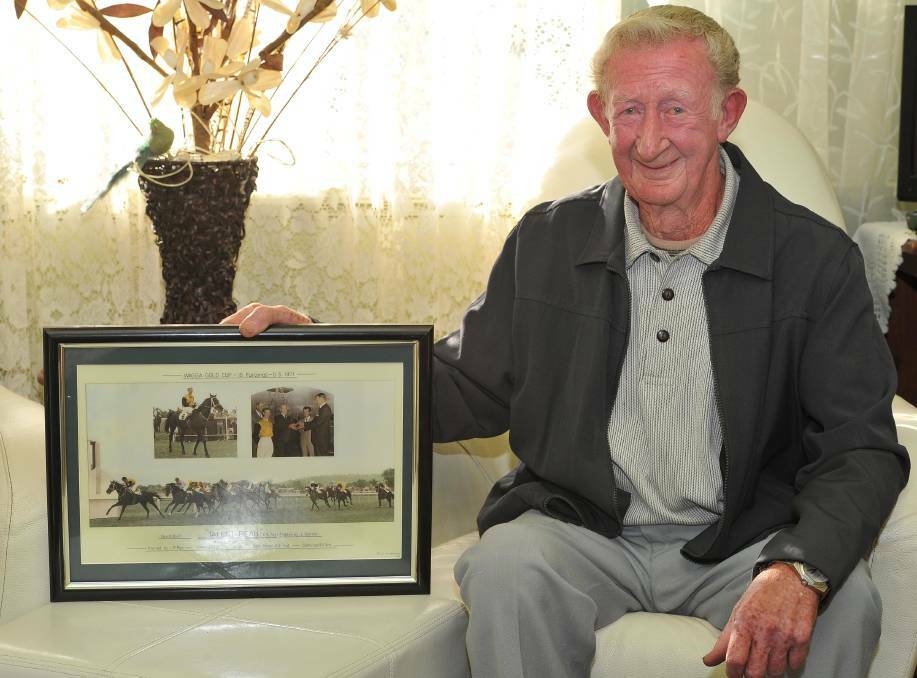 FOND MEMORIES: Retired jockey Lyn Toshack looks back at his Wagga Gold Cup win in 1971 on Talent Beau at his Wagga home in 2014. Picture: Kieren L Tilly