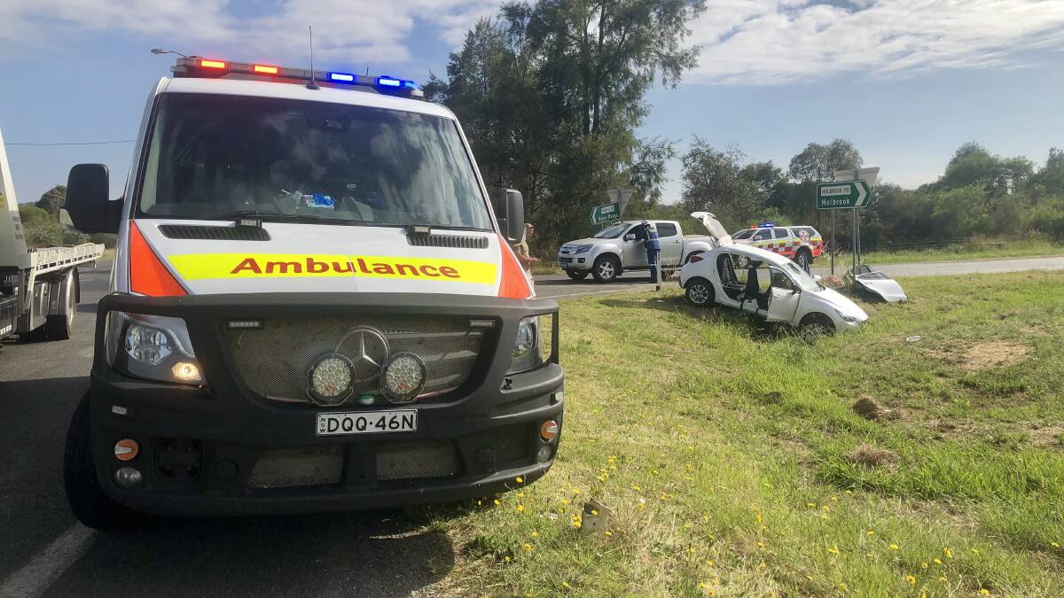 Patients are being treated at the scene of a two-car crash at an intersection on Holbrook Road. Picture: Toby Vue