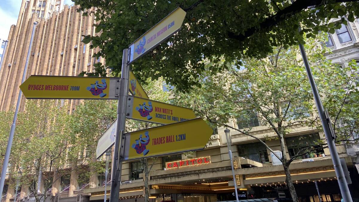 Signs outside Town Hall, the heartbeat of the Melbourne International Comedy Festival, point to other major festival landmarks. Picture by Daisy Huntly