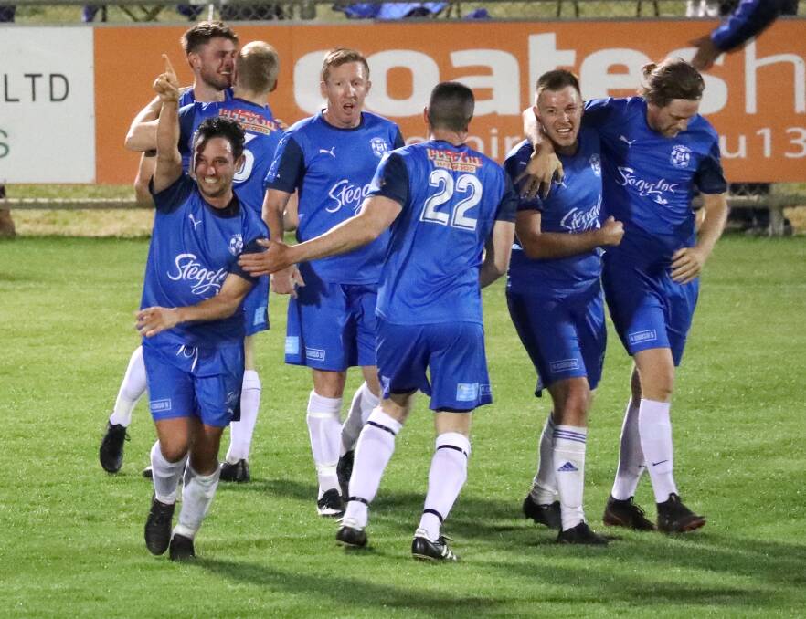 MATCH WINNER: Hanwood's Joey Schirripa (left) celebrates with teammates after his second goal of the Pascoe Cup grand final. Picture: Les Smith