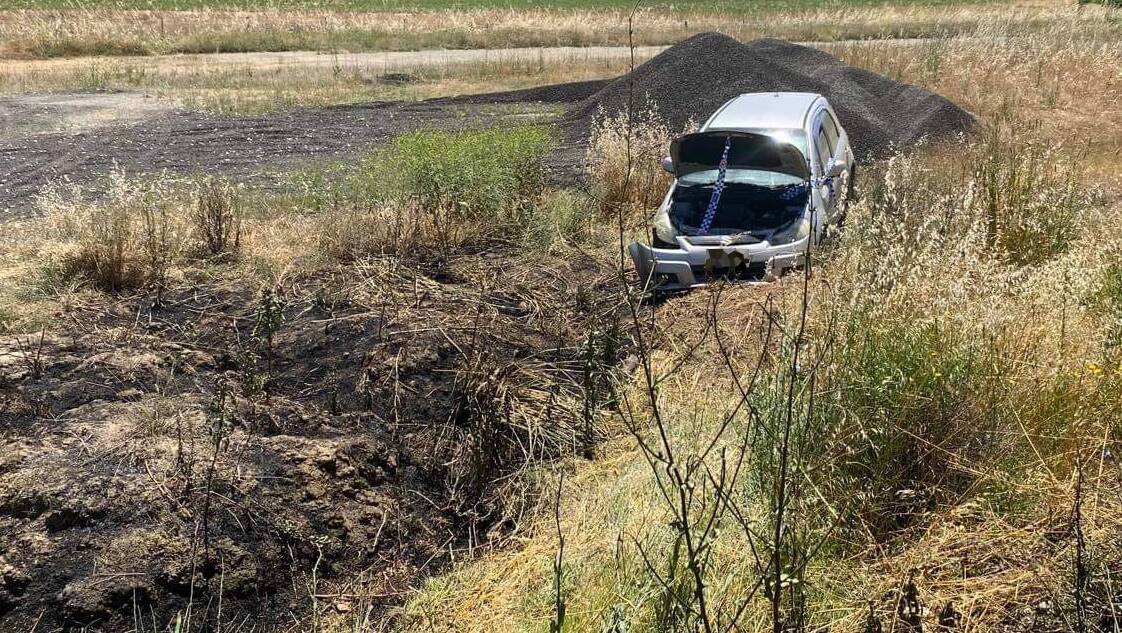 A car crash on Oura Road sparked a grass fire on Wednesday morning. Picture: Daina Oliver