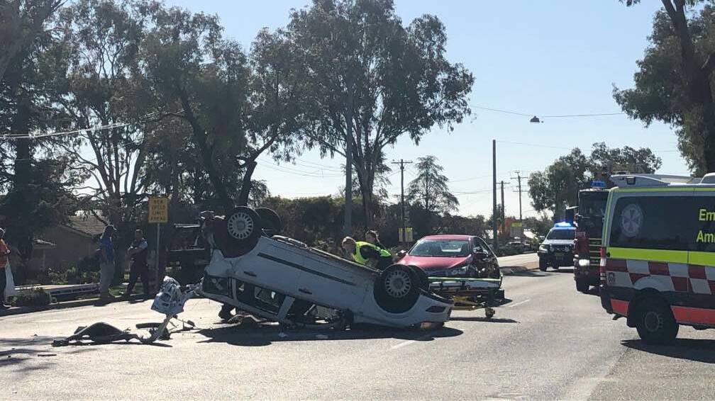 Bourke Street was blocked in both directions after a car flipped on Thursday. Picture: Emma Hillier