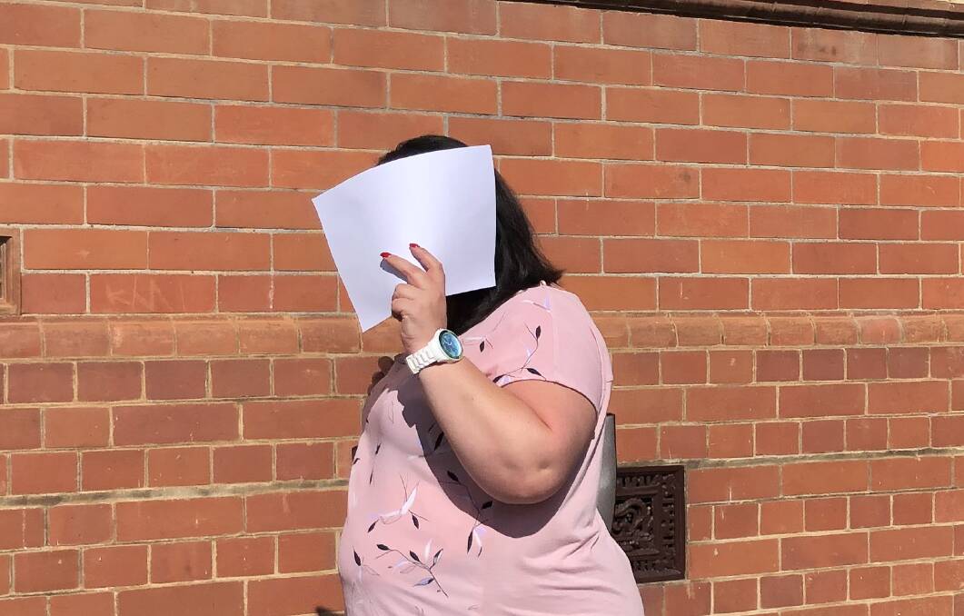 GUILTY: Tracy Lee Dowling, 41, hides her face as she leaves Wagga District Court moments after being convicted of the manslaughter in 2018. She was jailed for seven years last year. 