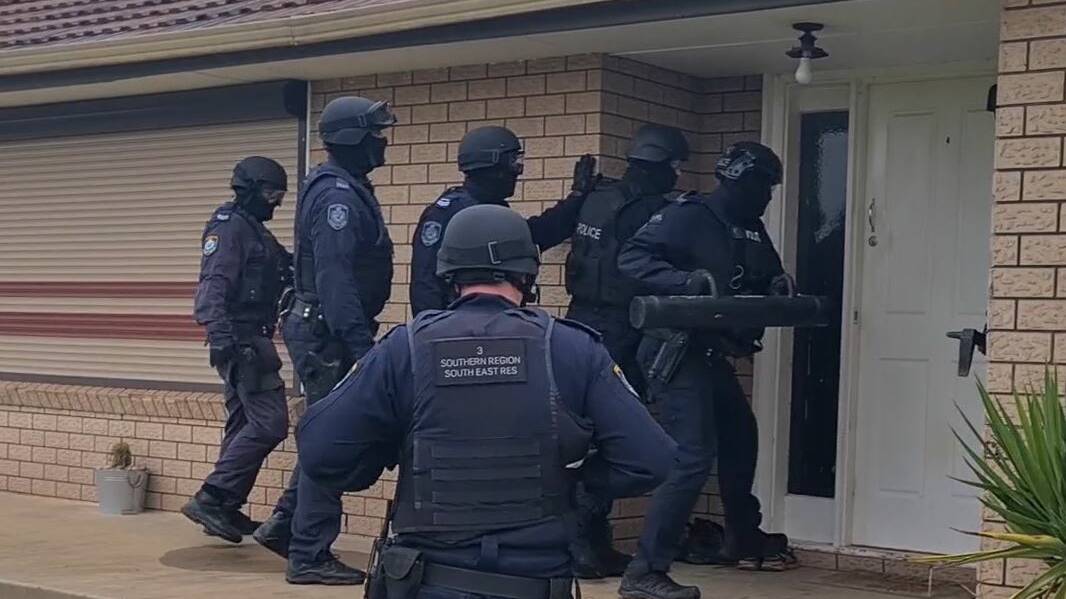 Strike Force Yatama detectives were supported by specialist teams executing search warrants in Leeton on Thursday. Picture: NSW Police/Screengrab