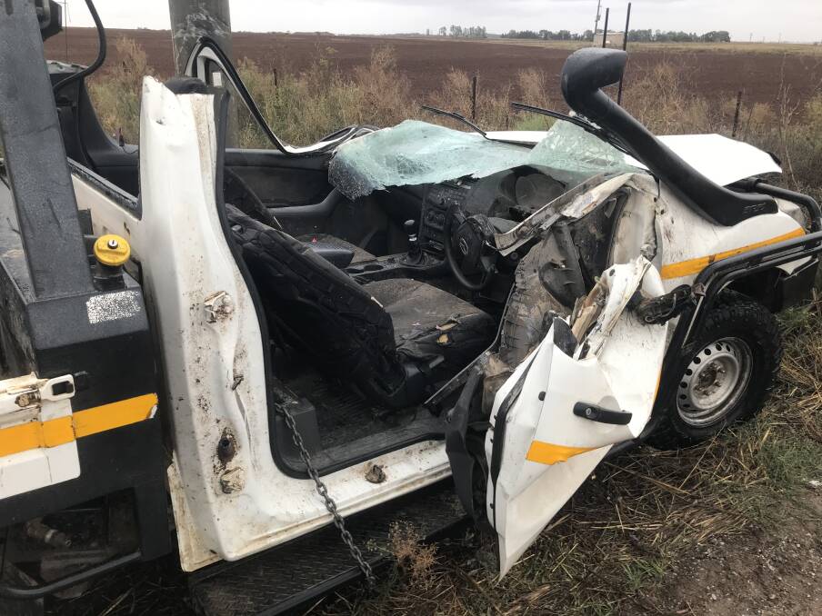CLOSE CALL: A man had to be cut free from his vehicle after rolling into a pole outside Tharbogang on Monday morning. Picture: Supplied
