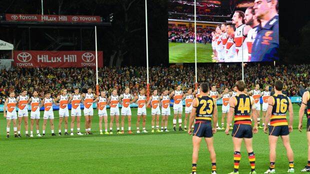 The Giants opted to link arms in the face of the Crows' unusual stance. Photo: AAP

