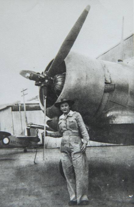 Sheila pictured with an Australian Wirraway aircraft on which she worked during the war. Photo: Fairfax