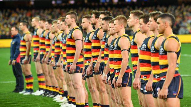 The Crows stand for the national anthem before the win over GWS. Photo: AAP