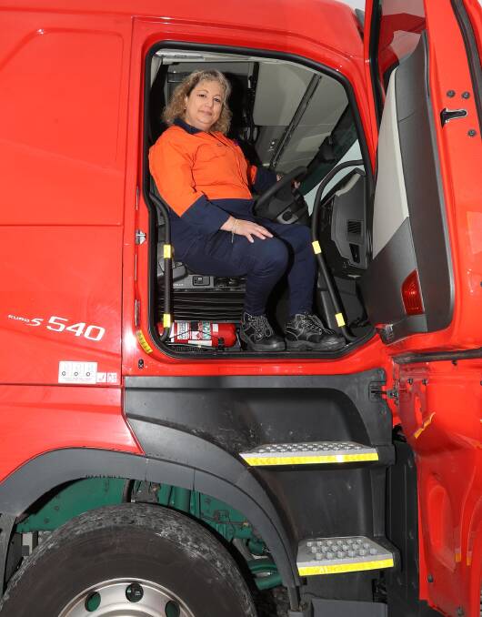BEHIND THE WHEEL: Barbara Konstantakis ready to go on day one of her new gig as a truckie. Picture: Les Smith