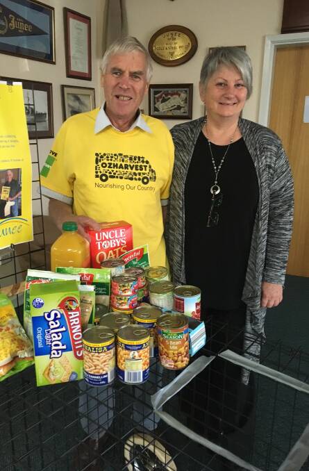 A GOOD CAUSE: OzHarvest Junee coordinator John Foord with Junee community transport supervisor Shirley Crivellero collecting food for the less fortunate. 