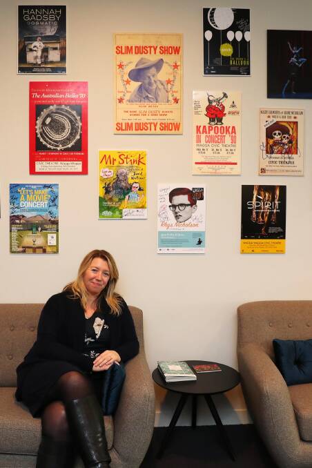 Civic Theatre manager Carissa Campbell with archived promotional posters from some of the best productions in the theatre's history. Picture: Emma Hillier