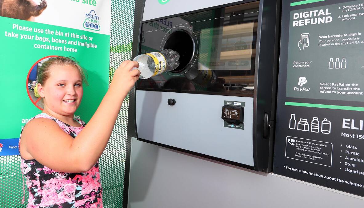KA-CHING: Wagga's Emma Livingstone, 9, delivers used bottles and cans to the North Wagga Return and Earn recycling depot to make herself some tidy pocket money. Picture: Kieren  L Tilly