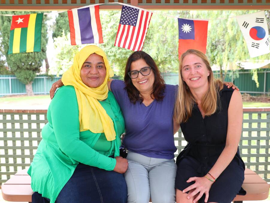 CELEBRATION: Afraa Osman, Geeta Parajuli from the Multicultural Council, and Claire Kendall from the Womens Health Centre preparing for International Women's Day this Thursday. Picture: Kieren L Tilly