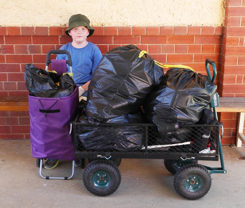 GIVING BACK: Wagga's William Goldstraw, 11, decided to give half the money he earned from returning cans and bottles to the Guide Dogs. Picture: Kieren L Tilly