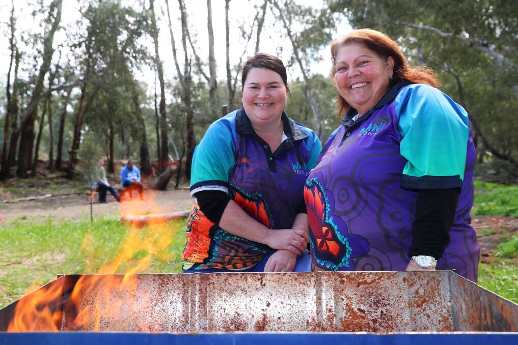 COMMUNITY AND CULTURE: Wawi Festival committee members Ash Pengelly and Aunty Mary Atkinson celebrating the start of a week's celebrations. Picture: Emma Hillier