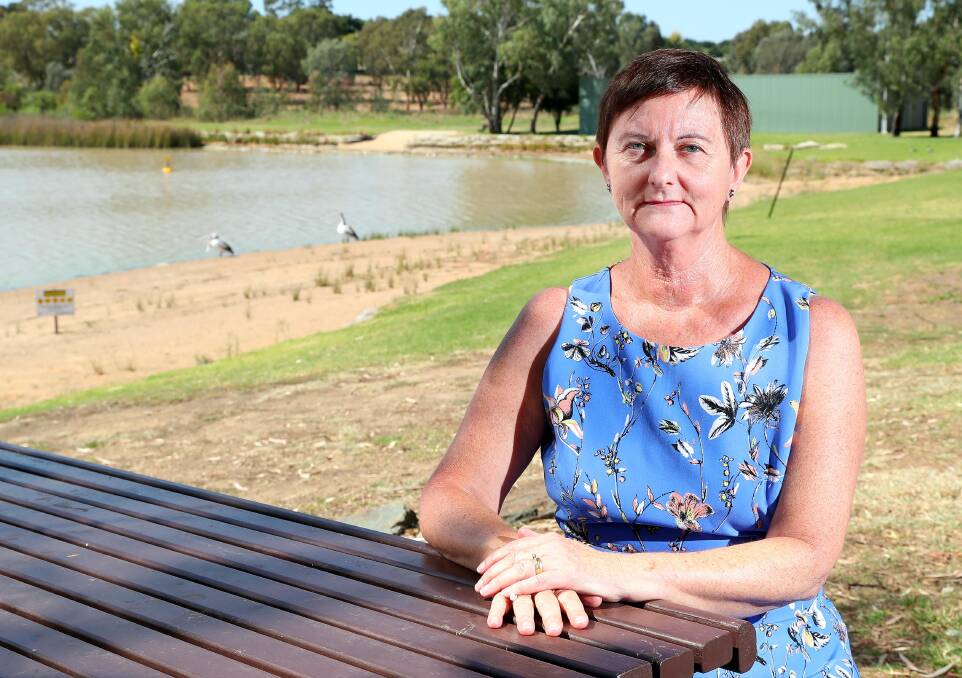 DISAPPOINTED: Lake Albert resident Claire Baker misses the beauty and shade the old willow trees used to provide - but they could also hold the answer to the lake's blue-green algae outbreak. Picture: Kieren L Tilly