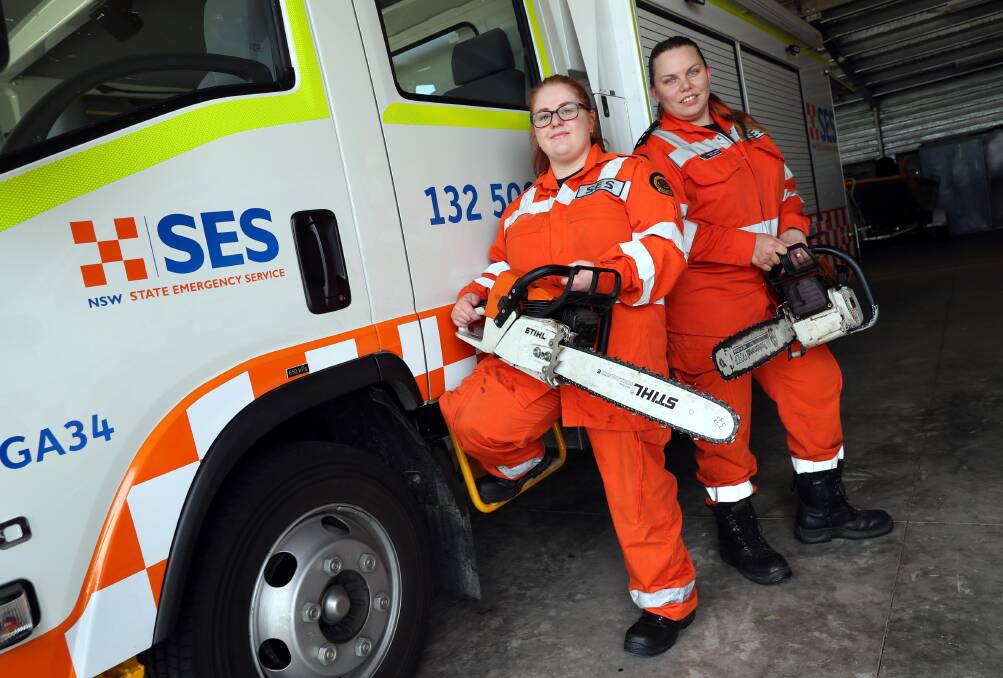 HELP OUT: Samantha Cheater and Madison Harvey are some of the "Orange Heroes" at Wagga's SES unit, and now they're looking for more volunteers. Picture: Les Smith