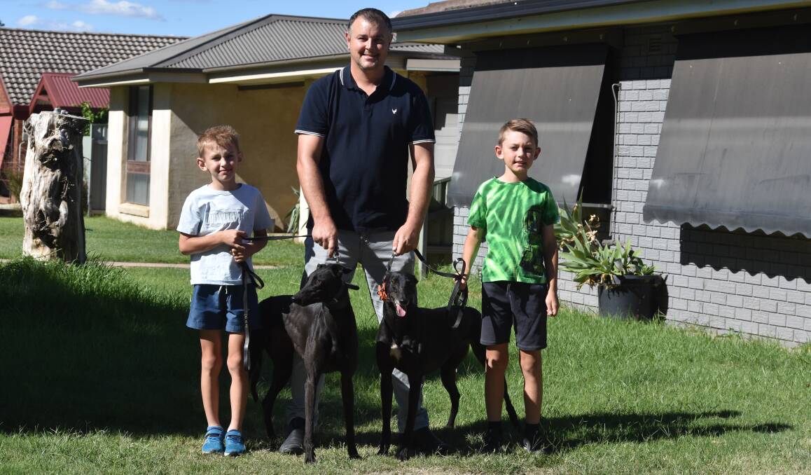 FAMILY AFFAIR: Chris Newcombe with sons Braxdyn, 9, and Laiken, 8, and their two chances at Wagga on Friday Dana Maggie and Kaique. Picture: Courtney Rees