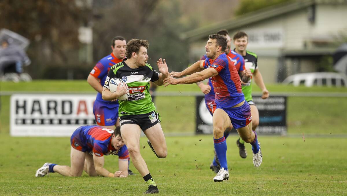 OUT OF MY WAY: Ty Fletcher tries to palm off James Smart in Albury's win over Kangaroos at Greenfield Park on Sunday. Picture: Ash Smith
