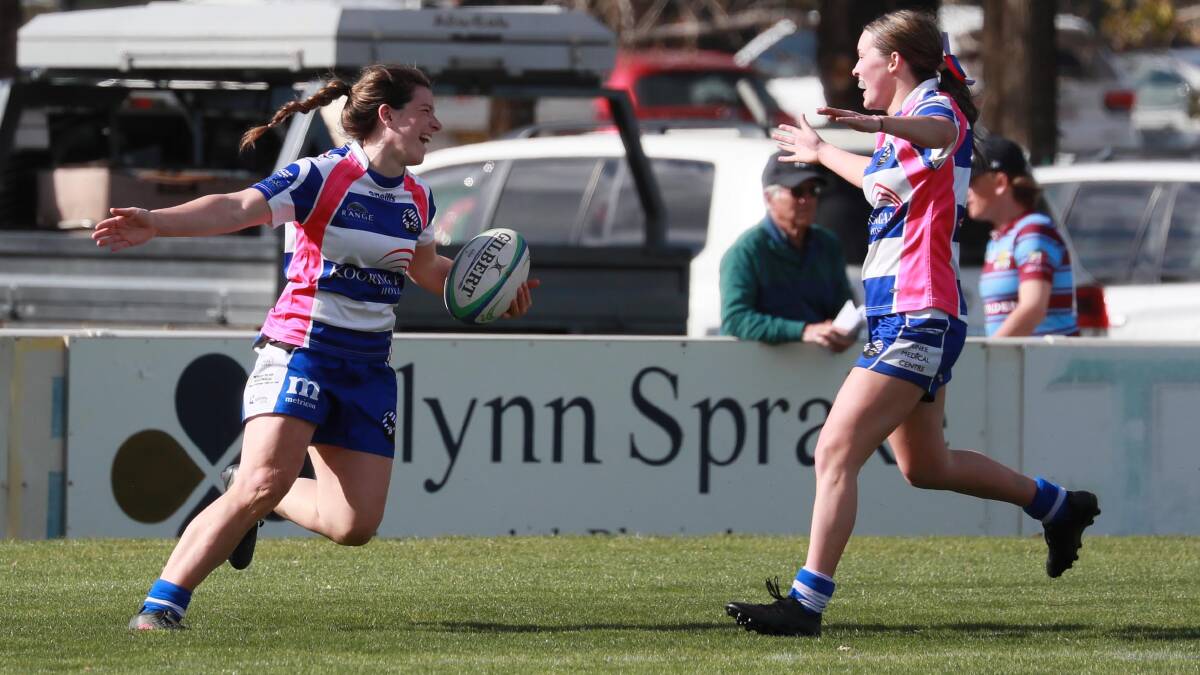 PARTY TIME: Apryll Green and Sarah Deaner celebrate a try in Wagga City's win over Waratahs on Saturday. Both scored doubles ahead of a finals rematch. Picture: Les Smith