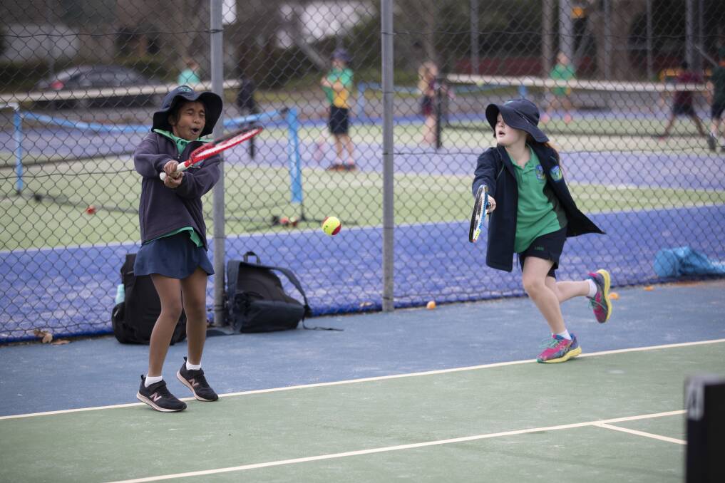 PRACTICE MAKES PERFECT: Lutheran School students Quinnzaarra Sankar and Sass Cook practice their shots during a break in the Todd Woodbridge Cup at South Wagga Tennis Club on Friday. Picture: Madeline Begley