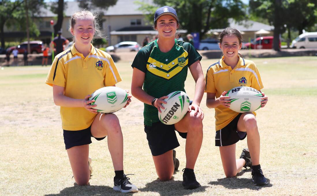 FUTURE IS BRIGHT: Kooringal High School students Sophie Quintal, 12, and (right) Alex Maiden,13, with Tess Staines as part of the Girls Get Active program at Bolton Park on Monday. Picture: Emma Hillier