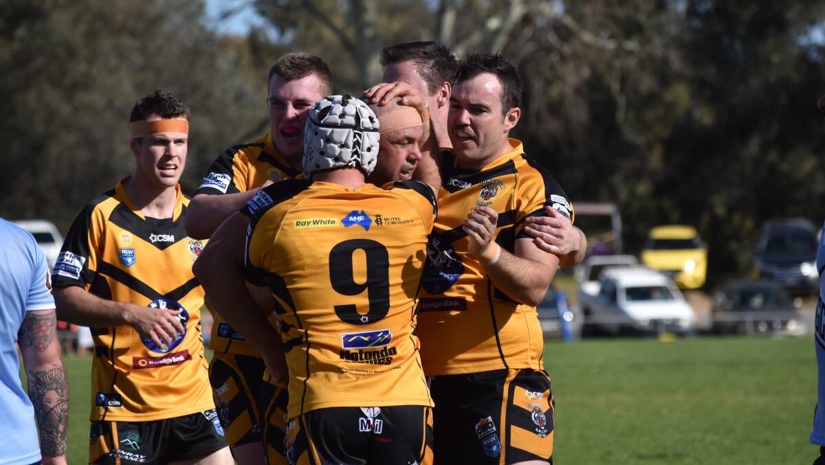 Gundagai celebrates after Luke Berkrey scored in their tight loss to Tumut on Saturday. The two teams tackle each other again on Sunday.