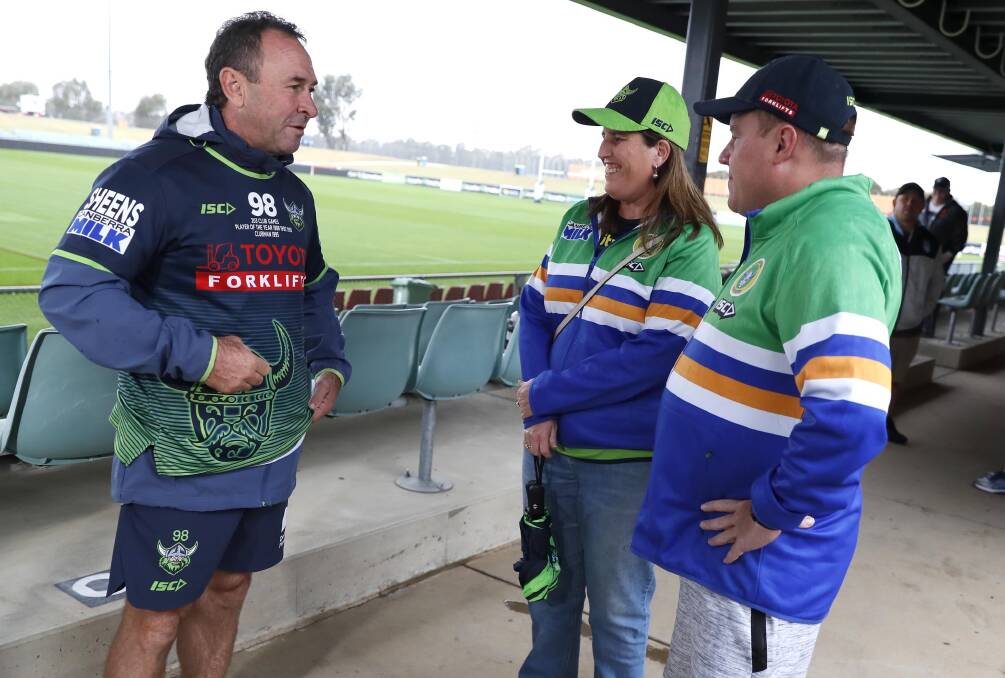 BACK IN TOWN: Canberra coach Ricky Stuart with Wagga locals and Raiders fans Emily Bartley and Scott Gerhardy. Picture: Les Smith