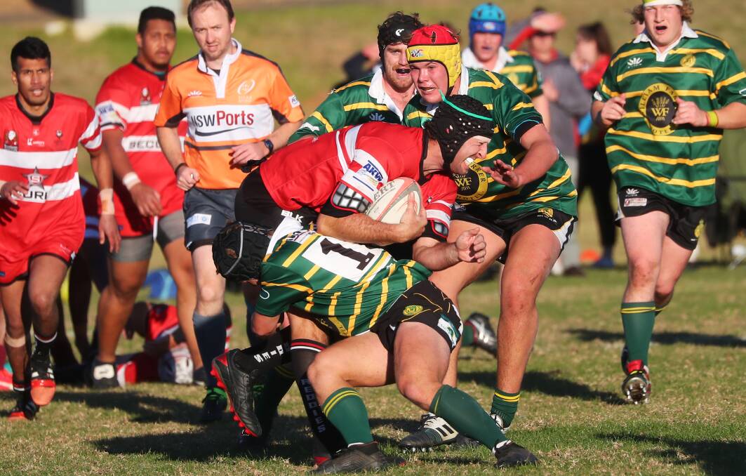 GOING LOW: Rob McMahon gets crunched in a tackle as CSU just fell short of their first win of the season up against Ag College on Saturday. Picture: Emma Hillier
