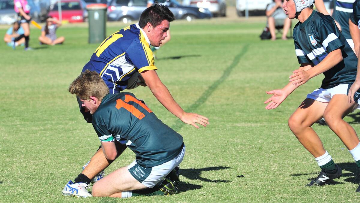 BIG GAME: Kooringal High's Brody Tracey gets brought down by TRAC's Henry Yates last week. Kooringal plays Wagga High School for a place in the Hardy Shield final.