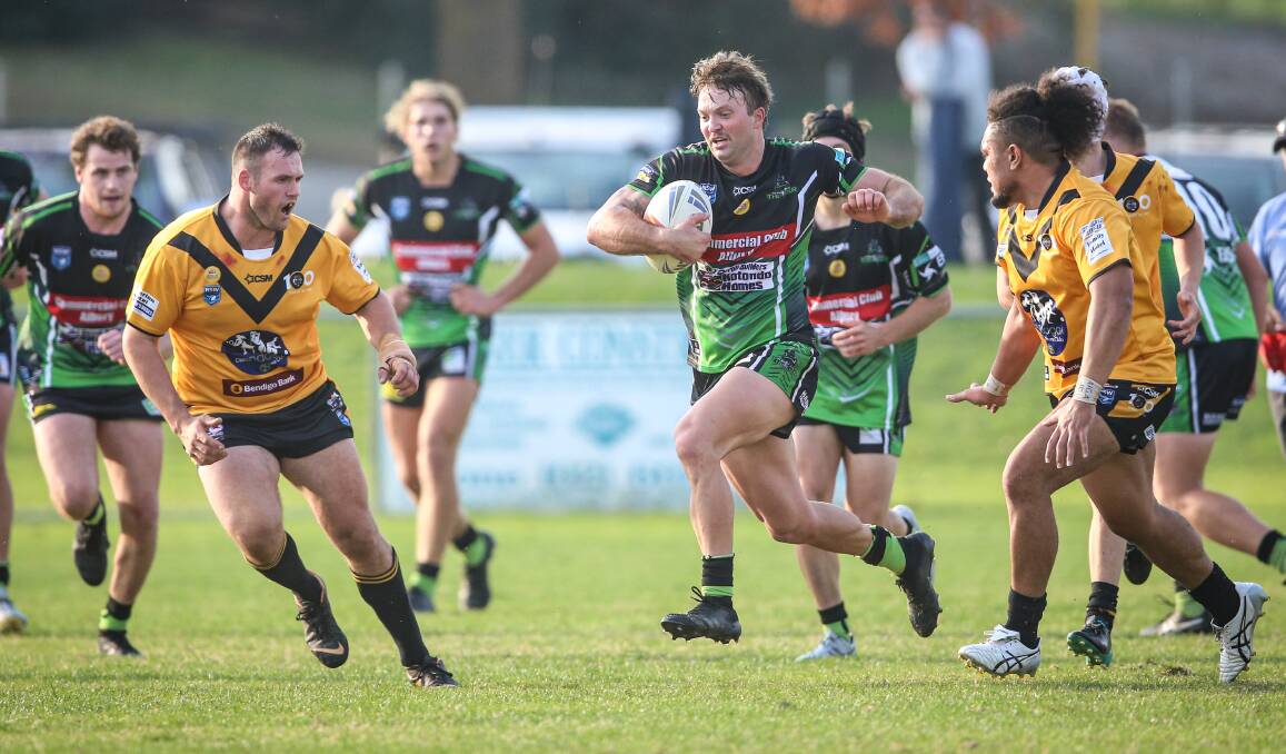 ROLLING THROUGH: Albury Thunder's Harry Reicher splits Gundagai's defence in an absorbing clash on Saturday. Picture: James Wiltshire