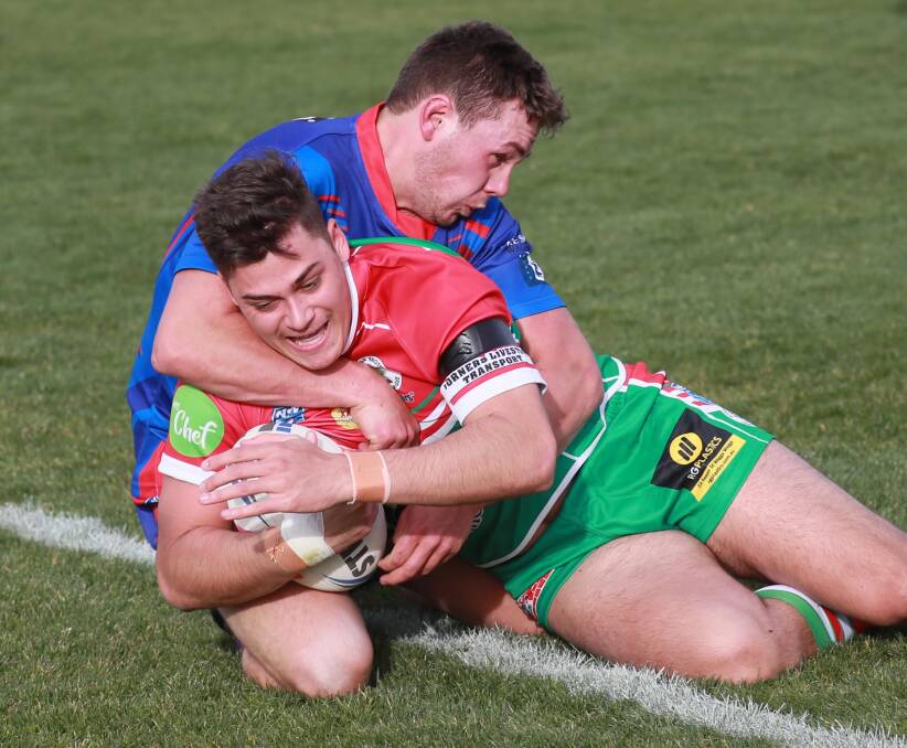 TRY TIME: Zac Graham can't stop Jordan Little from scoring as Brothers started the season with a 30-10 win over Kangaroos at Equex Centre on Saturday. Picture: Les Smith