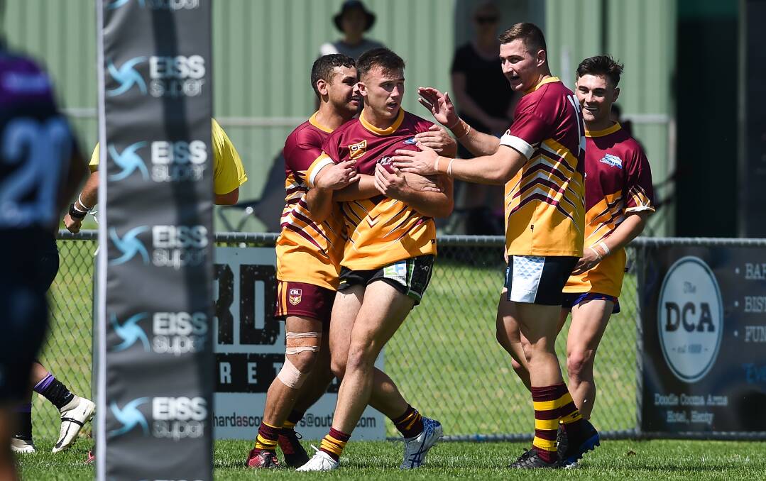 GOOD JOB: Mathew Lyons and Hayden Ashcroft celebrate after Liam Wiscombe's try as Riverina under 23s scored a trial win over Victoria under 20s on Saturday.